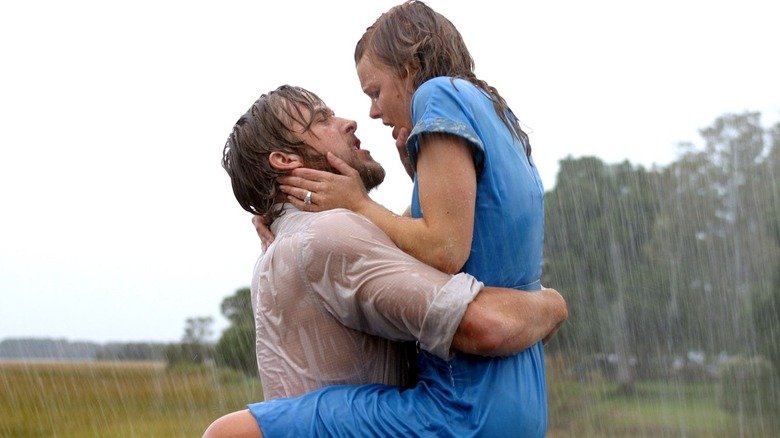 Noah (Ryan Gosling) carries me (Rachel McAdams), who carries his head enthusiastically in her hands while they accept the rains