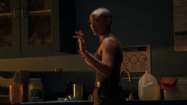 Nora holds her hands to surrender in the last season 2