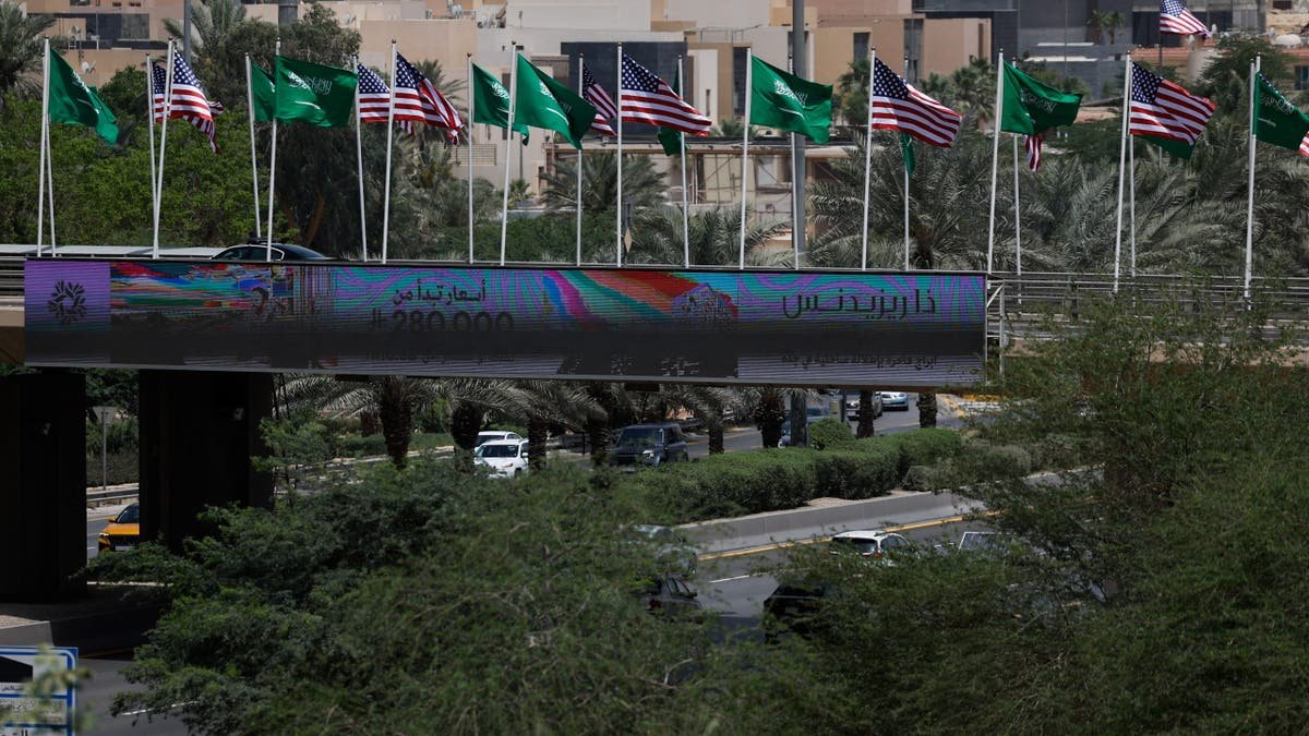 The United States, Saudi flags fly along the highway in Riyadh before Trump's visit