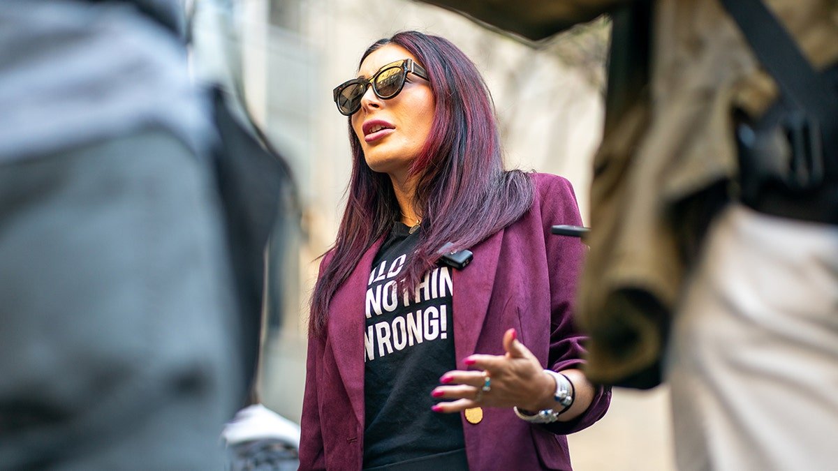 Laura Loomer wears sunglasses