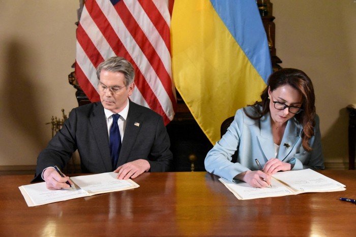 Treasury Secretary Scott Bessin and Prime Minister First Ukrainian Yulia Sfaidinko sign a deal