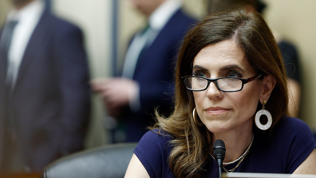 Representative Nancy Mass wears glasses