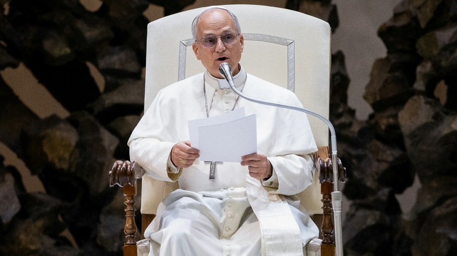 Pope Leo fourteen holds fans with media representatives in the Paul VI Hall in the Vatican, May 12, 2025.