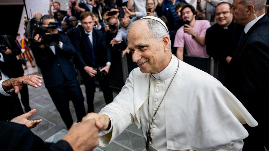 Pope Liu fourteen walks through an audience with representatives of the media in the Paul VI Hall in the Vatican, May 12, 2025.