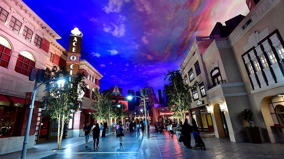 People wander around Warner Bros. World, the first entertainment park bearing the Warner brand, in the capital of the United Arab Emirates Abu Dhabi on July 27, 2018 - The park was officially opened to the public on July 25 after two years of construction. (Photography GiusePPE CACACE / AFP) (GiusePPE CACACE / AFP must be read via Getty Images)