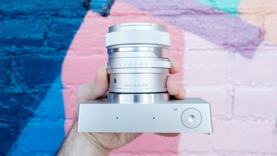 Sigma BF does not have a hot shoe holder or camera lens.