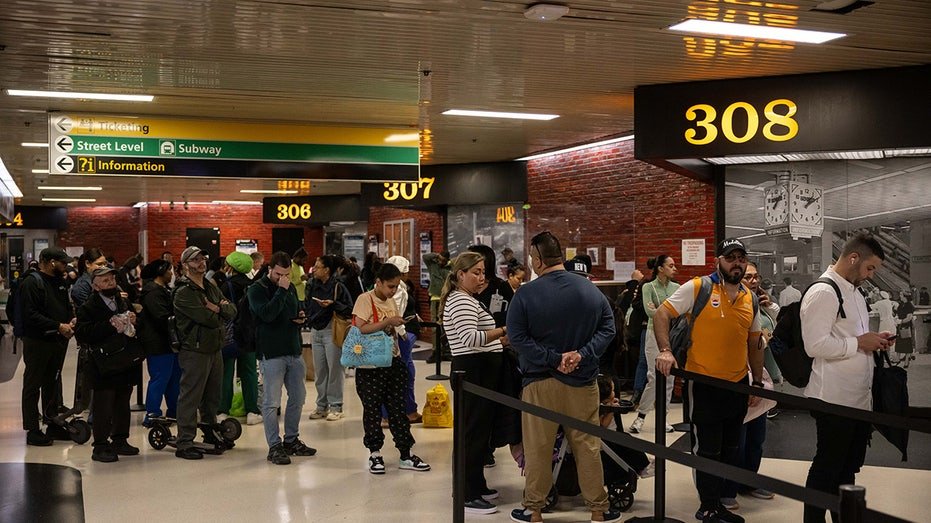 People are waiting for buses in a railway