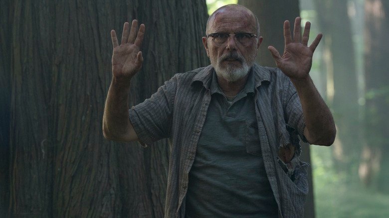 Eugene raises his hands in the air at the end