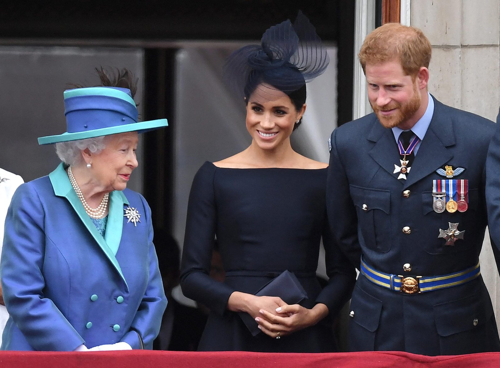 Megan Markle and Prince Harry with the Queen in the royal family watch Rafai 100