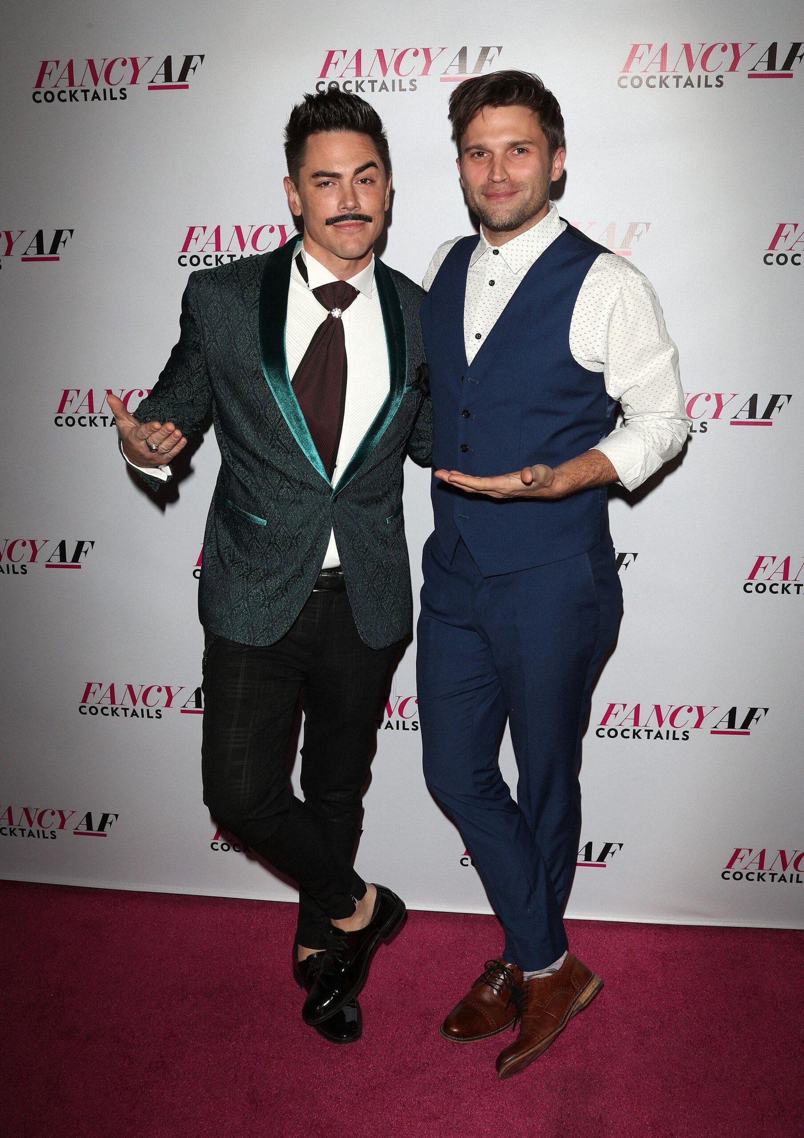 Tom Sandoval and Tom Schwartz demonstrate on the red carpet. 