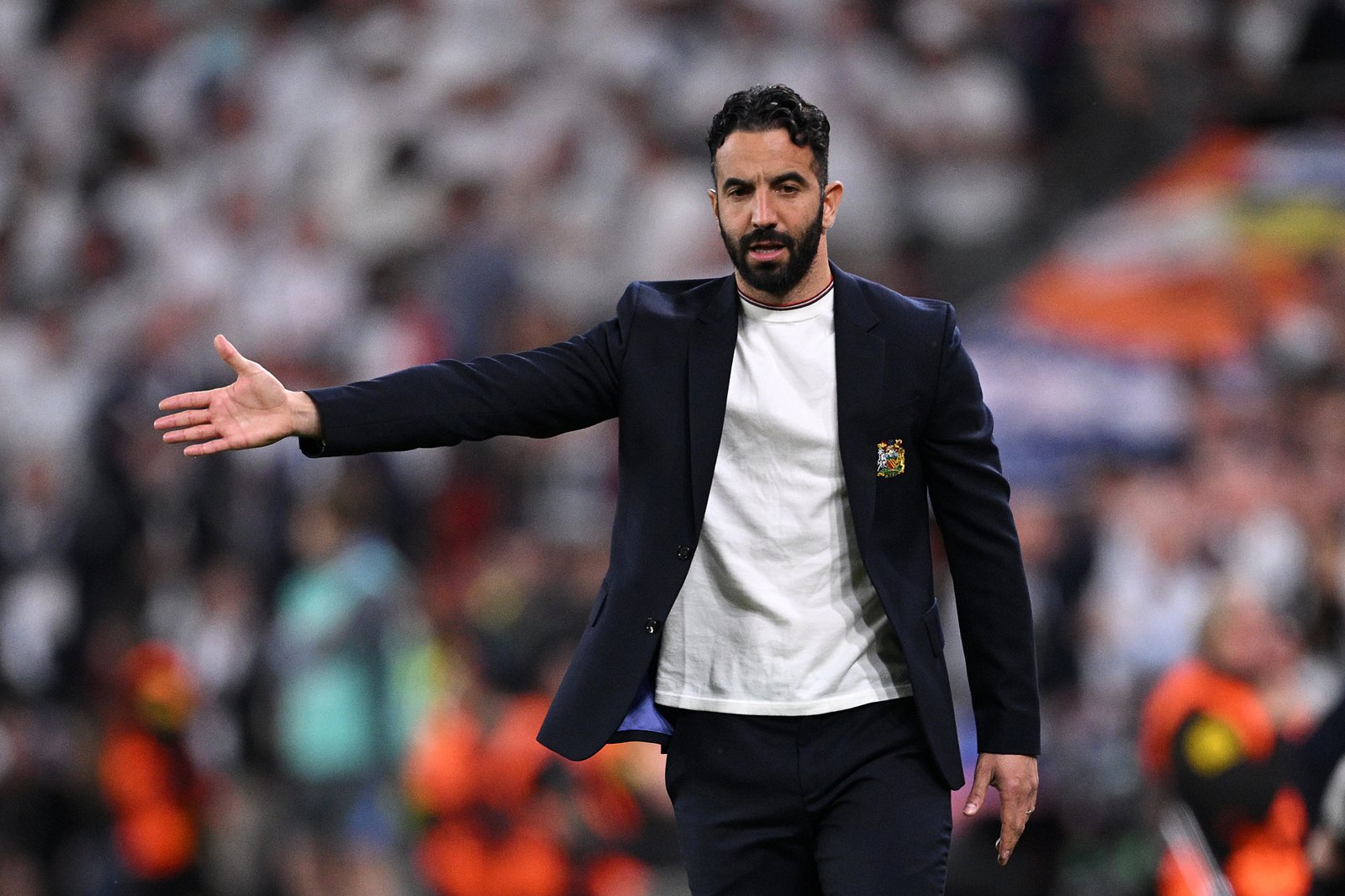 Robin Amorim, Manchester United director, provides instructions for players from the touch line