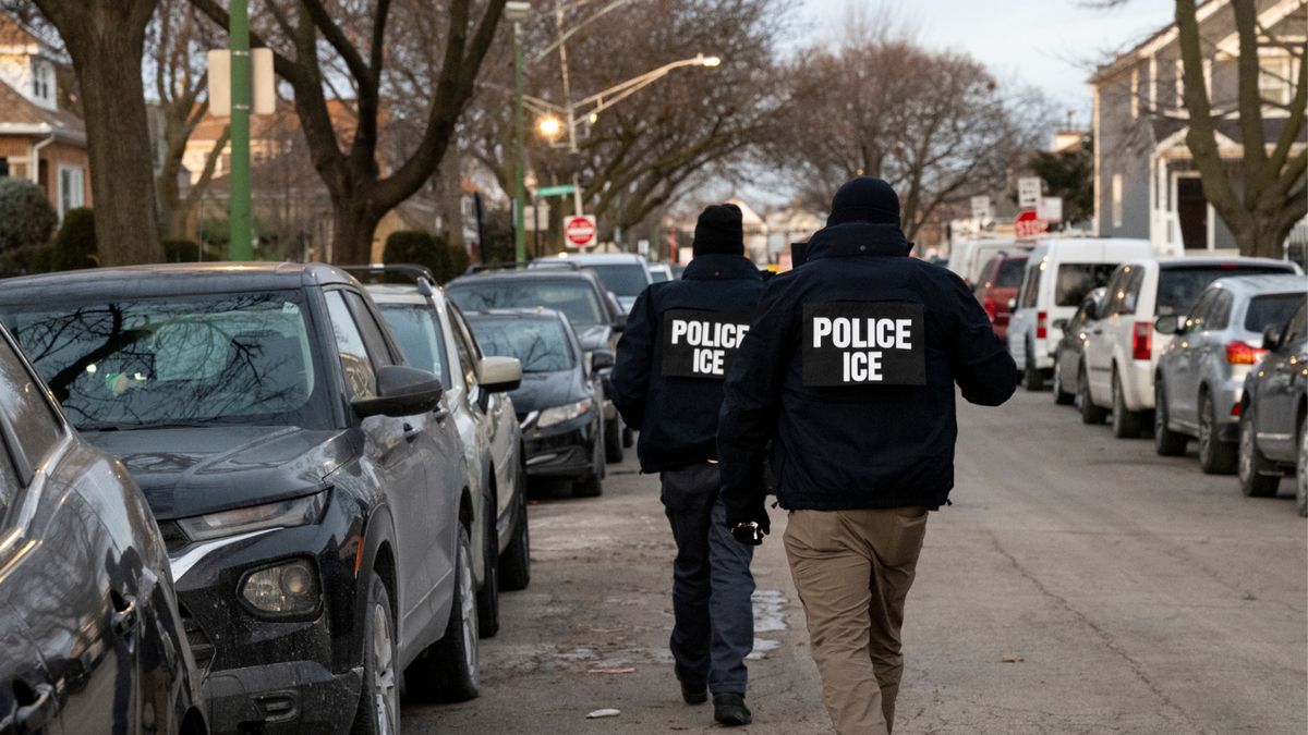 Ice officers walk on the street