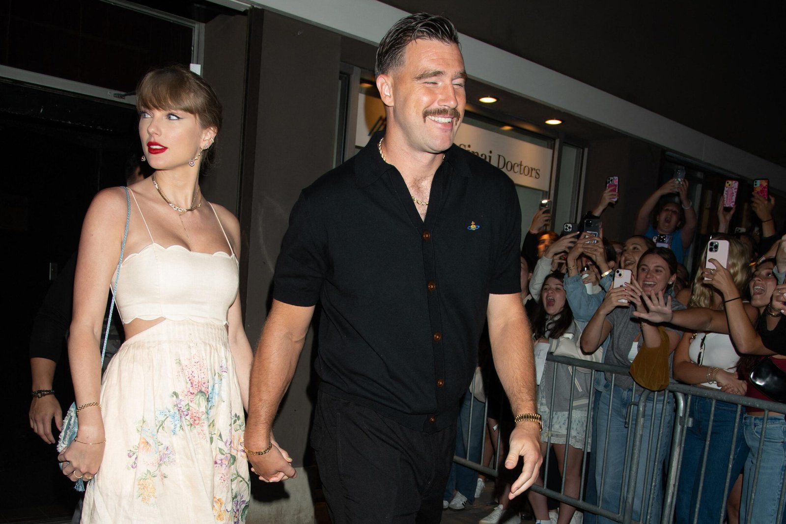 Taylor Swift and Taravis Kelts attend the wedding of Karen Elson
