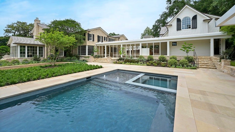 The backyard is also characterized by a large swimming swimming.
