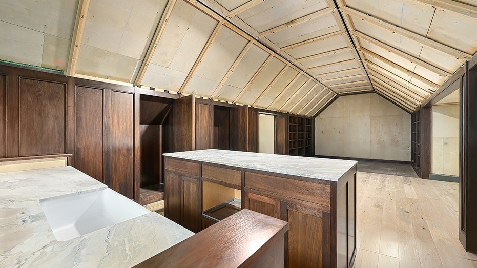 Above the garage, a check room and the bar area.