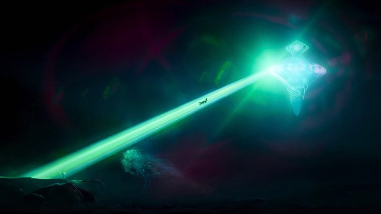ELIO is pulled through a green beam of light in a crust -like spacecraft