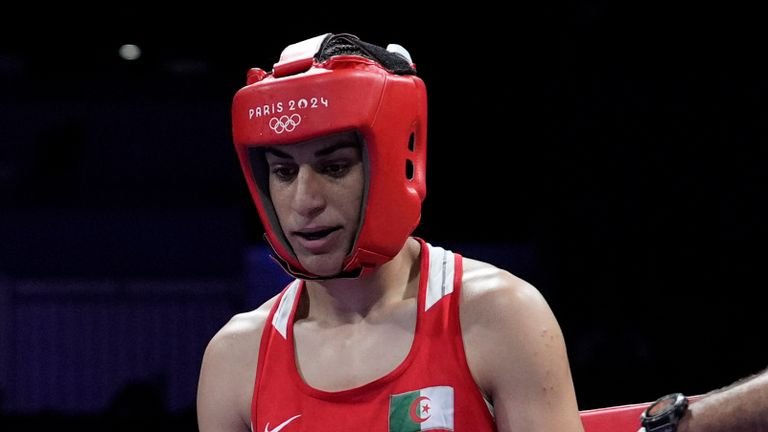 Imane Khelif from Algeria is preparing to fight Angela Karenie in Italy in the 66 kg initial boxing match at the Summer Olympics 2024, Thursday, August 1, 2024, in Paris, France. (AP Photo/John Locher)