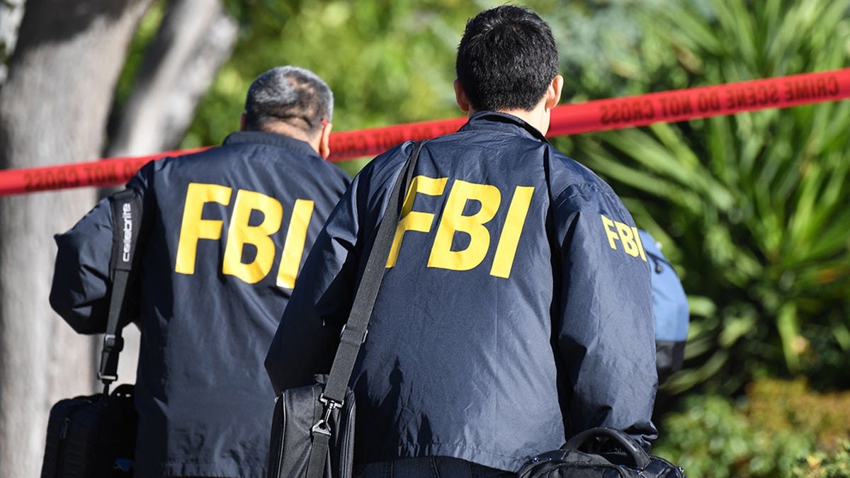 FBI agents are running through the crime scene