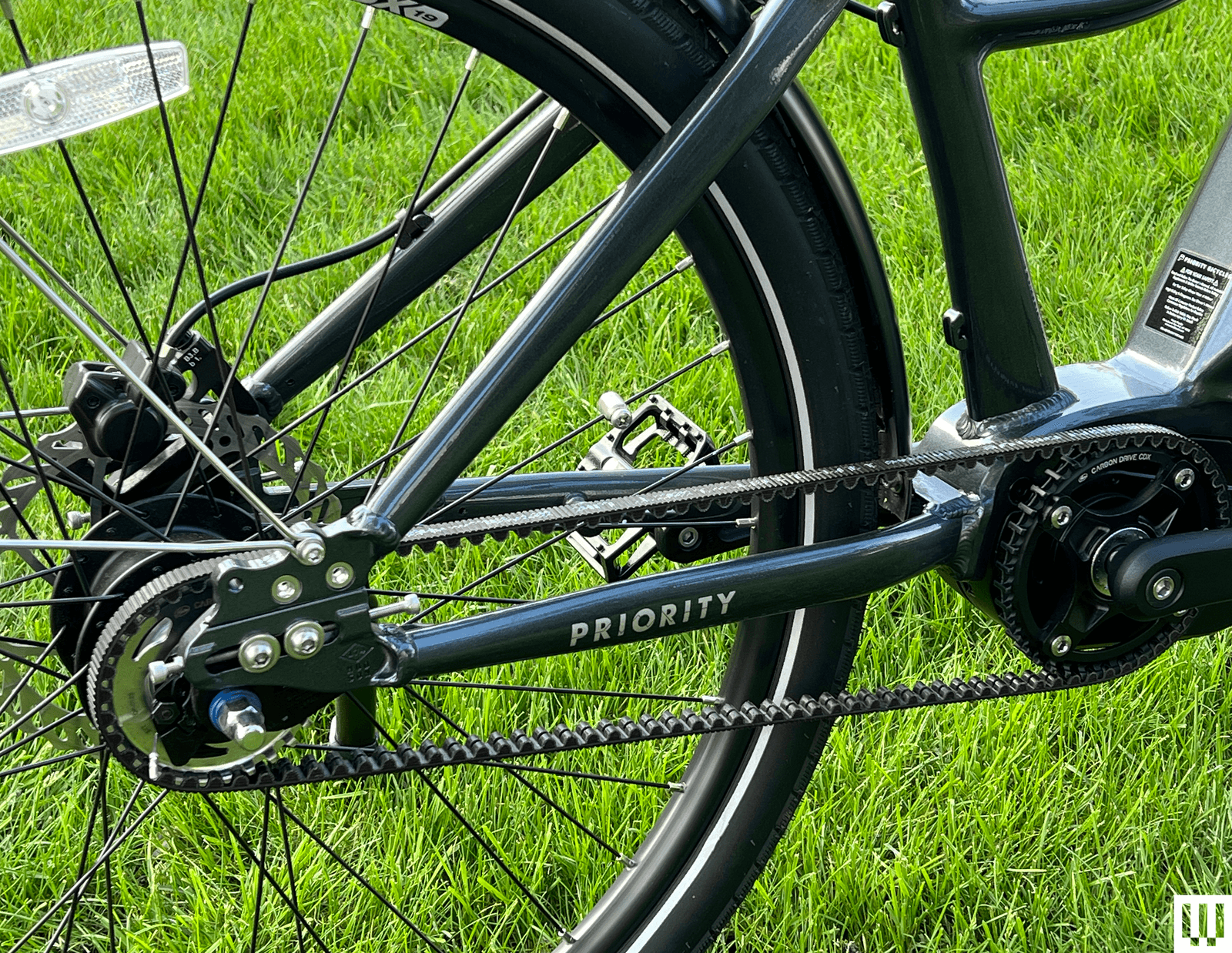 The image may have a machine that speaks vehicle transport wheels and grass plants
