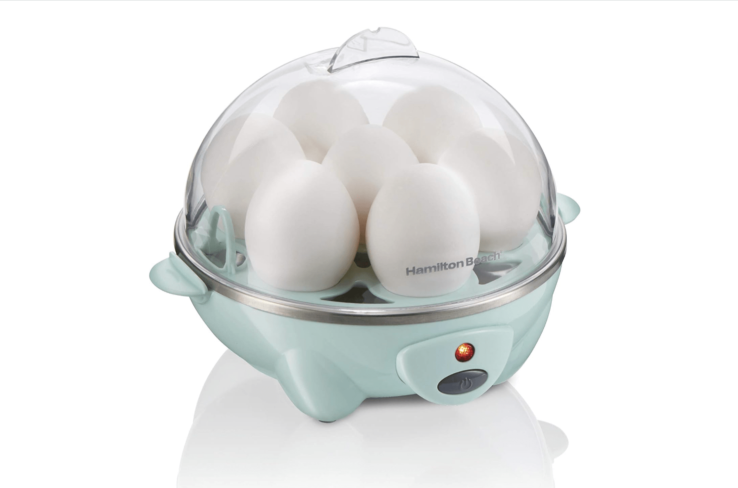 Egg cooker with the top and seven eggs inside.