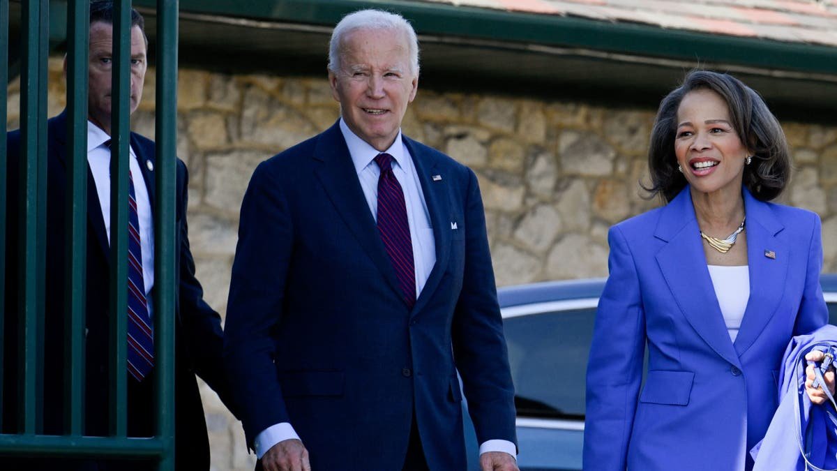 Former President Joe Biden, Left, Senator Lisa Planet Rochester, de, right