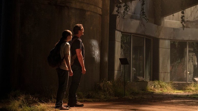 Elie and Joel look at something at the end