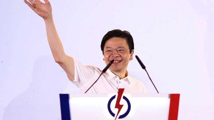 Singapores ruling party sweeps to victory as voters opt for.jpg