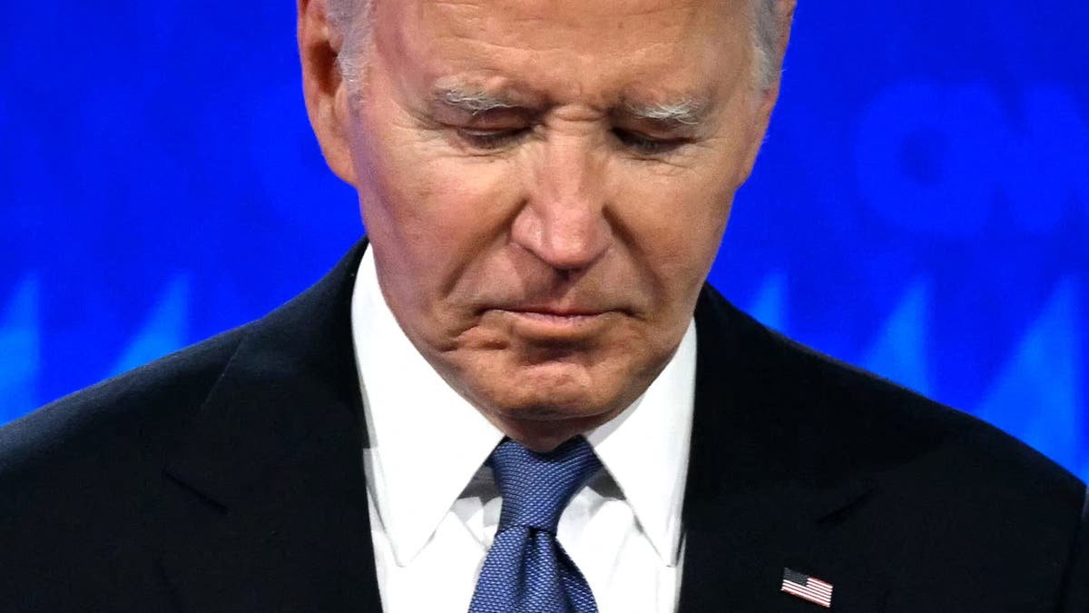 President Joe Biden looks down during his discussion with former President Donald Trump at CNN in Atlanta on June 27, 2024.