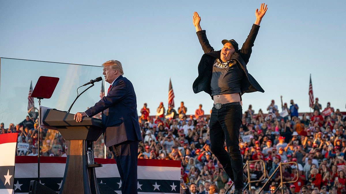 Musk jumps on stage while Trump speaks
