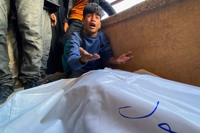 The Palestinians are saddened by the bodies of relatives who were killed by Israeli fire while they were gathering near the United States -backed aid center, at Nasser Hospital in the Southern Gaza Strip on June 3