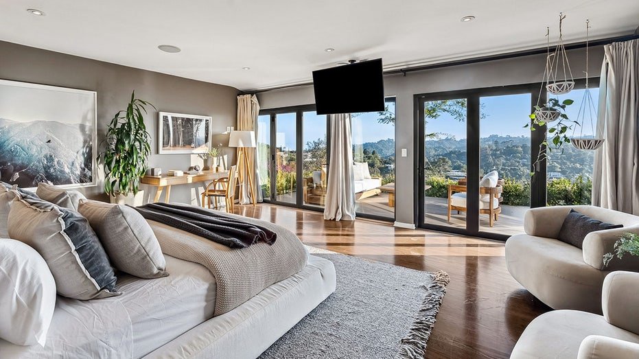 The basic bedroom features glass doors from floor to ceiling that leads to a special outdoor balcony.