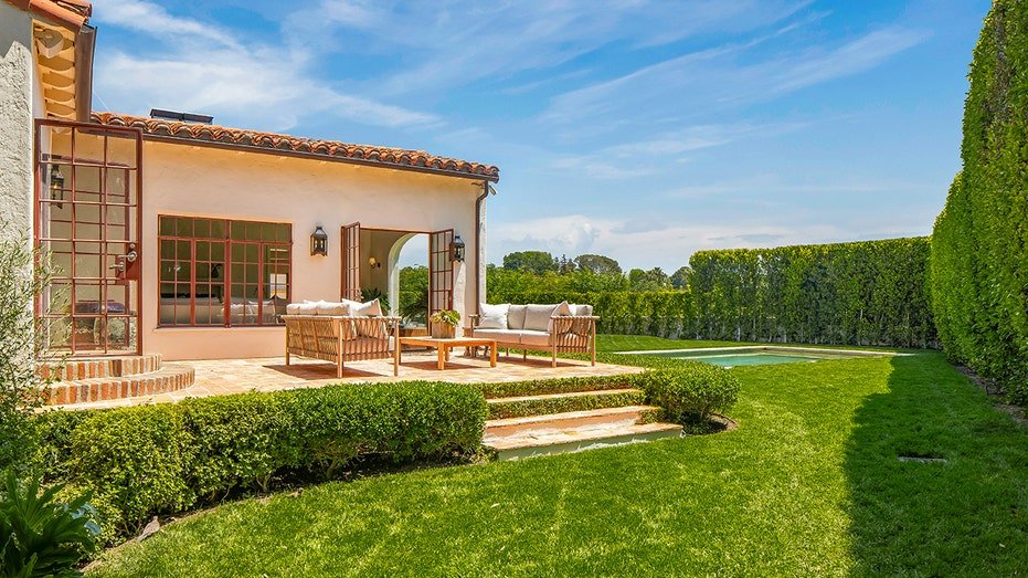 The outdoor sitting area can be reached through the living room.