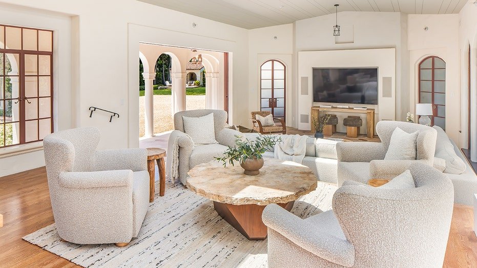 The family room features wooden floors and a sliding door from floor to ceiling.