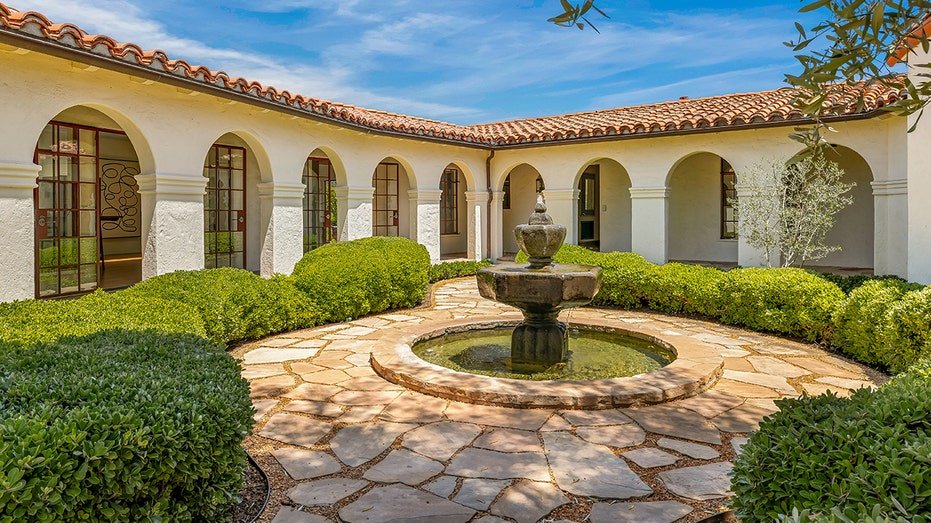 There is also a courtyard that includes a fountain in the front yard.