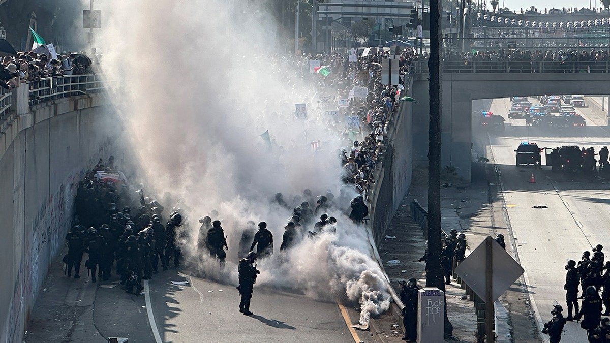 La Riot with a cloud of tear gas