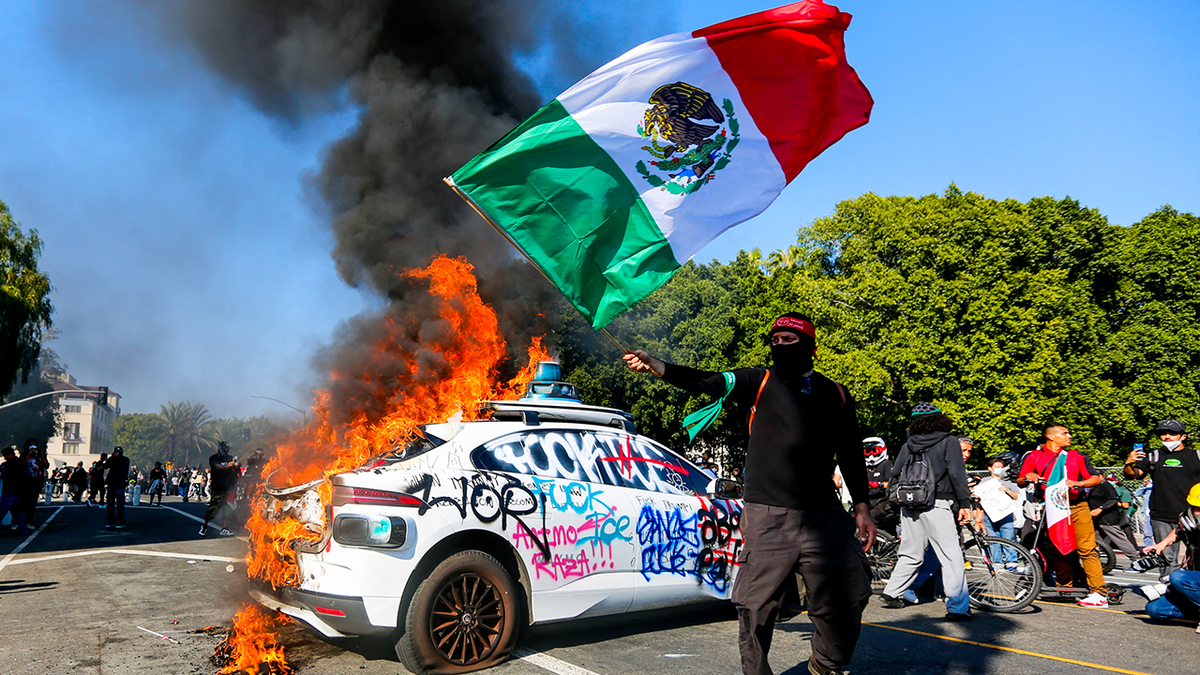 Burning the car as a protesting science waving