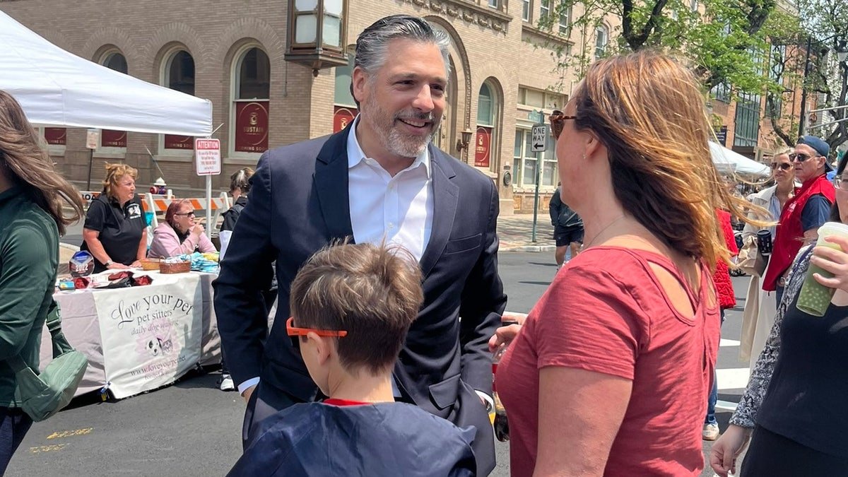 Republican governor candidate Bill Spadi speaks with voters at the Somalefel Street Exhibition, New Jersey, on June 1, 2025.