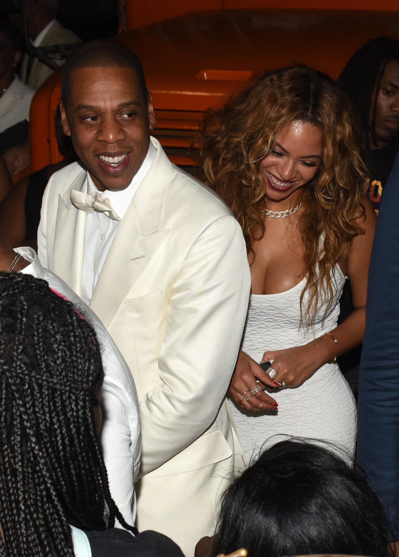 Beyonce and Jay Z are laughing together during an event.