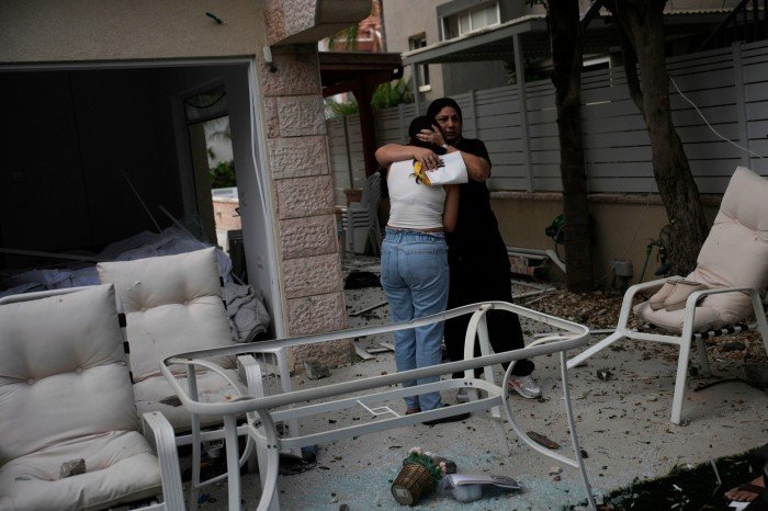 The residents interact after their house was hit by a missile