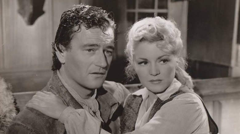John Wayne in the role of James Smith and Clair Trevor in the role