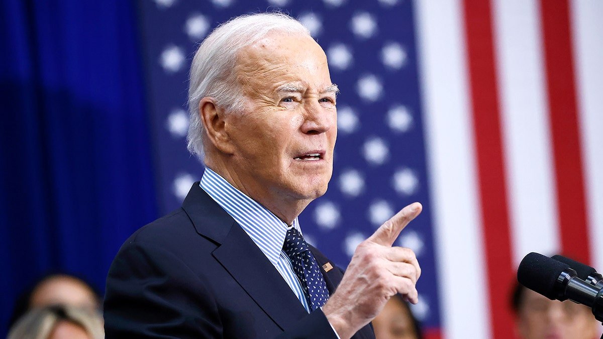 Joe Biden is close, the American flag behind it