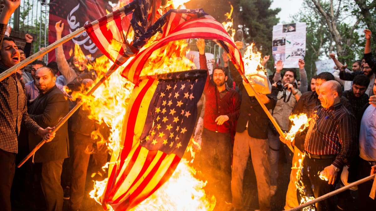 Satan burns our flags