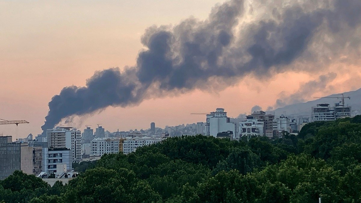 Smoke rises from Iranian government television