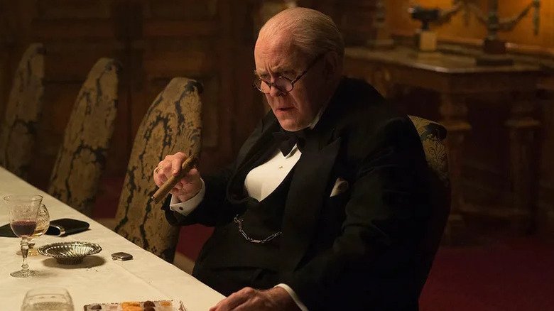Winston Churchill from John Lihjo smokes a cigar on the crown