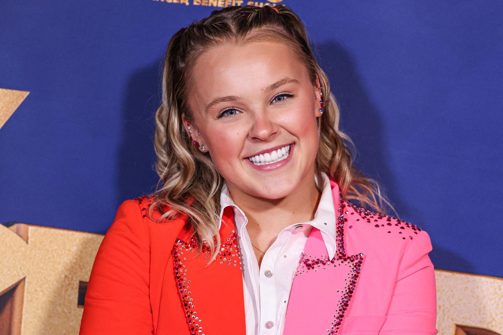 Jojo Siwa thinks on the red carpet.