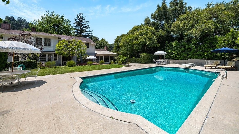 The backyard also features a large swim space and herb area.