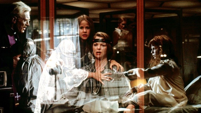 Linda Blair in the role of Reagan McKenil, Max von Sido in the role of Father Mirren, and Louise Fletcher in the role of Dr. Jin Tuskin in possession of the second evil spirits: heretic
