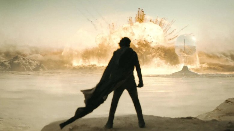 Paul Atreides (Timothee Chalamet) stands at the top of the mountain in 