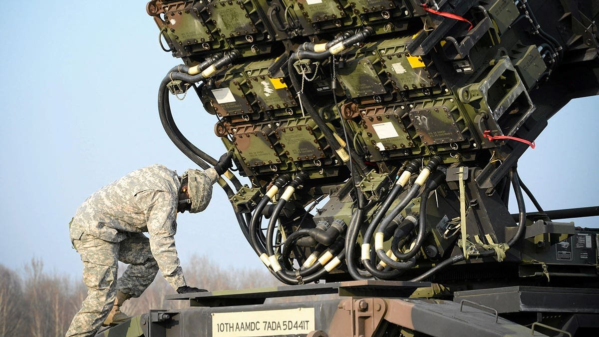 An American soldier checks a Patriot missile defense battery during joining exercises in military lands in Sochko, near Warsaw, on March 21, 2015.