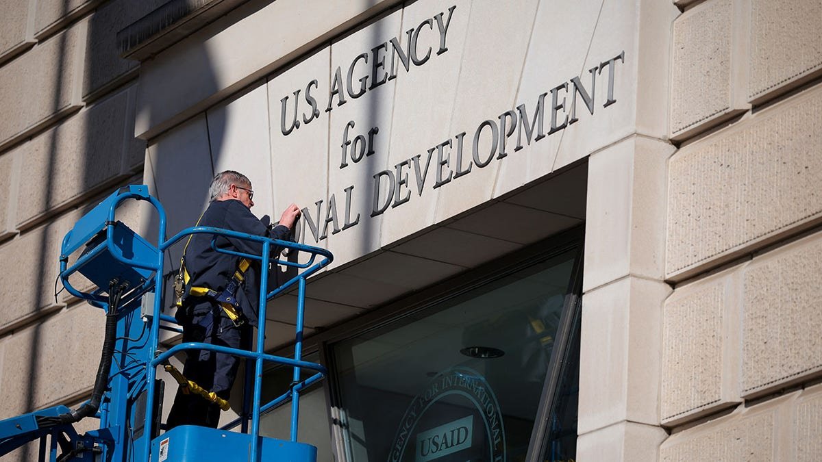 The construction of the United States Agency for International Development, a man who drops messages